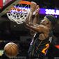 Miami Heat forward Jimmy Butler dunks during the second half of an NBA basketball game against the Washington Wizards, Thursday, Nov. 18, 2021, in Miami. The Heat won 112-97. (AP Photo/Lynne Sladky)