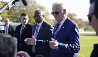 President Joe Biden speaks to reporters as he returns to the White House, Friday, Nov. 19, 2021, in Washington, from Walter Reed National Military Medical Center. (AP Photo/Alex Brandon)
