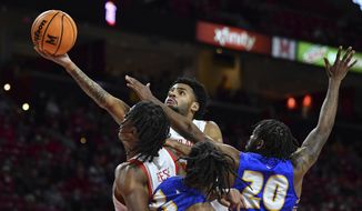 Maryland guard Eric Ayala, top, goes to the basket for a layup against Hofstra guard Jalen Ray (20) during the second half of an NCAA college basketball game, Friday, Nov. 19, 2021, in College Park, Md. (AP Photo/Terrance Williams)