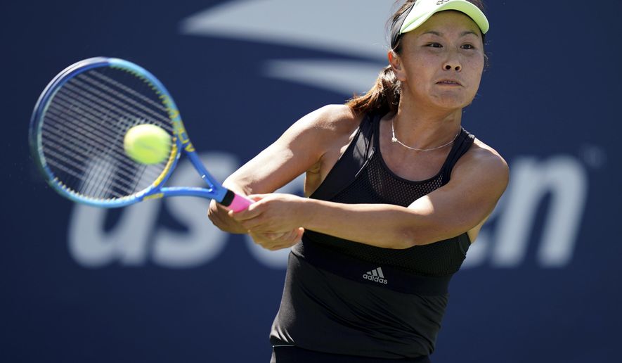 FILE - Peng Shuai, of China, returns a shot to Maria Sakkari, of Greece, during the second round of the US Open tennis championships on ug. 29, 2019, in New York. China&#39;s Foreign Ministry is sticking to its line that it isn&#39;t aware of the controversy surrounding tennis professional Peng Shuai, who disappeared after accusing a former top official of sexually assaulting her. A ministry spokesperson said Friday that the matter was not a diplomatic question and that he was not aware of the situation. (AP Photo/Michael Owens, File)