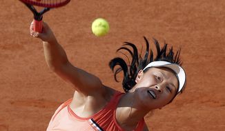 FILE - China&#39;s Peng Shuai serves to France&#39;s Caroline Garcia during their second round match of the French Open tennis tournament at the Roland Garros stadium, on May 31, 2018 in Paris. China&#39;s Foreign Ministry is sticking to its line that it isn&#39;t aware of the controversy surrounding tennis professional Peng Shuai, who disappeared after accusing a former top official of sexually assaulting her. A ministry spokesperson said Friday that the matter was not a diplomatic question and that he was not aware of the situation. (AP Photo/Michel Euler, File)