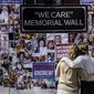 In this file photo, Theresa Sari, left, and her daughter Leila Ali look at a protest-memorial wall for nursing home residents who died from COVID-19, including Sari&#x27;s mother Maria Sachse, March 21, 2021, in New York. A state Assembly committee investigation found former New York Gov. Andrew Cuomo&#x27;s administration made a political decision to misrepresent how many nursing home residents died of COVID-19. (AP Photo/Seth Wenig, File)