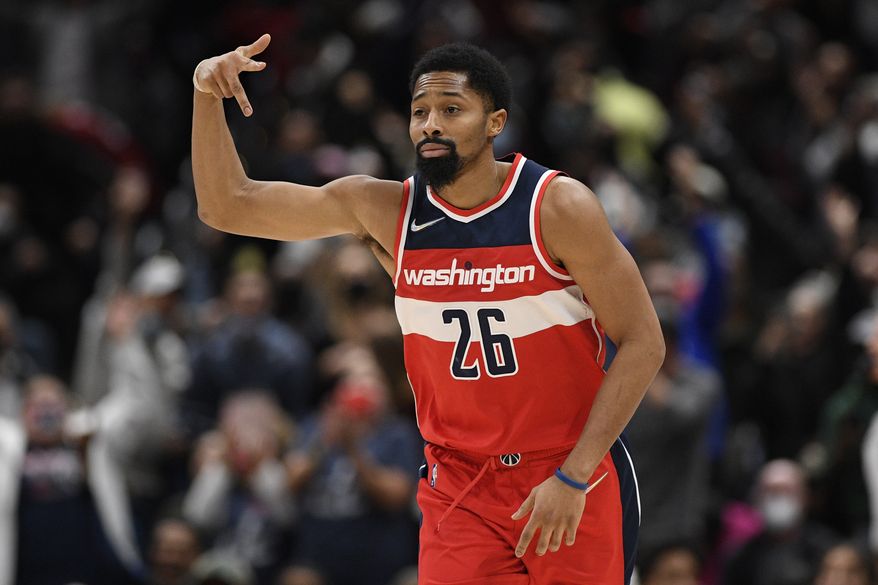 Washington Wizards guard Spencer Dinwiddie (26) gestures after he made a three-point basket during the second half of an NBA basketball game against the Miami Heat, Saturday, Nov. 20, 2021, in Washington. The Wizards won 103-100. (AP Photo/Nick Wass)