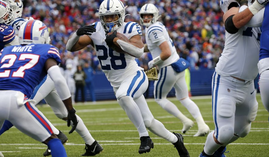 Indianapolis Colts running back Jonathan Taylor (28) plays during the first half of an NFL football game against the Buffalo Bills in Orchard Park, N.Y., Sunday, Nov. 21, 2021. (AP Photo/Jeffrey T. Barnes)