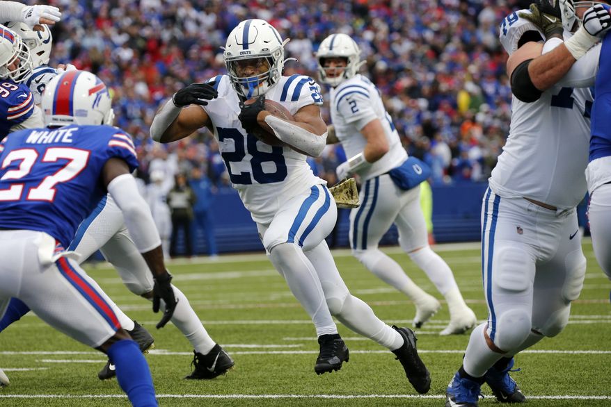 Indianapolis Colts running back Jonathan Taylor (28) plays during the first half of an NFL football game against the Buffalo Bills in Orchard Park, N.Y., Sunday, Nov. 21, 2021. (AP Photo/Jeffrey T. Barnes)