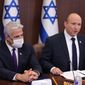 Israeli Prime Minister Naftali Bennett, right, and Foreign Minister Yair Lapid attend a cabinet meeting at the Prime minister&#39;s office in Jerusalem, Sunday, Nov. 21, 2021. (Abir Sultan/Pool via AP)