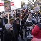 Protesters march, Sunday, Nov. 21, 2021, in Kenosha, Wis. Kyle Rittenhouse was acquitted of all charges after pleading self-defense in the deadly Kenosha shootings that became a flashpoint in the nation&#39;s debate over guns, vigilantism and racial injustice. (AP Photo/Paul Sancya)