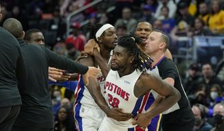 Detroit Pistons center Isaiah Stewart (28) is held back after a foul during the second half of an NBA basketball game against the Los Angeles Lakers, Sunday, Nov. 21, 2021, in Detroit. (AP Photo/Carlos Osorio)