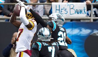 Washington Football Team wide receiver Terry McLaurin scores against Carolina Panthers free safety Jeremy Chinn during the first half of an NFL football game Sunday, Nov. 21, 2021, in Charlotte, N.C. (AP Photo/Jacob Kupferman)