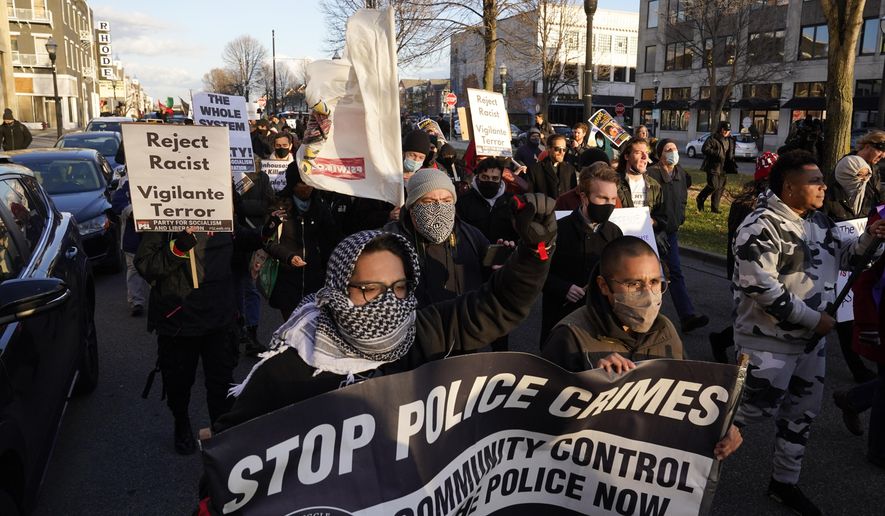 Protesters march on Sunday, Nov. 21, 2021, in Kenosha, Wis. Kyle Rittenhouse was acquitted of all charges after pleading self-defense in the deadly Kenosha shootings that became a flashpoint in the nation&#39;s debate over guns, vigilantism and racial injustice. (AP Photo/Paul Sancya)