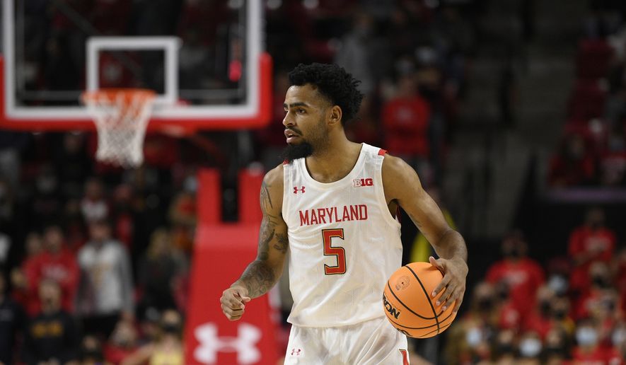 Maryland guard Eric Ayala (5) in action during the second half of an NCAA college basketball game against George Mason, Wednesday, Nov. 17, 2021, in College Park, Md. George Mason won 71-66. (AP Photo/Nick Wass) **FILE**