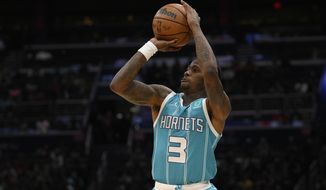 Charlotte Hornets guard Terry Rozier (3) shoots during the second half of the team&#39;s NBA basketball game against the Washington Wizards, Monday, Nov. 22, 2021, in Washington. (AP Photo/Nick Wass)