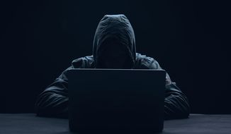 Cybersecurity hacker. (Photo credit: ViChizh / Shutterstock) ** FILE **