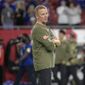 New York Giants offensive coordinator Jason Garrett watches players warm up before an NFL football game against the Tampa Bay Buccaneers, Monday, Nov. 22, 2021, in Tampa, Fla. The New York Giants have fired offensive coordinator Jason Garrett after a  dreadful performance in a nationally televised game against the Tampa Bay Buccaneers. The Giants (3-7) tweeted the decision Tuesday afternoon, saying the former Dallas Cowboys head coach had been relieved of his duties. (AP Photo/Phelan M. Ebenhack) **FILE**
