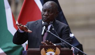 South African President Cyril Ramaphosa addresses the media after meeting with his Kenyan counterpart Uhuru Kenyatta in Pretoria, South Africa, Tuesday Nov. 23, 2021. Travel restrictions imposed on South Africa and other African nations for telling the world about the omicron variant are hypocritical, harsh and not supported by science, South Africa&#x27;s president said Monday, recalling the phrase used by the U.N. chief, who called such measures “travel apartheid.” (AP Photo/Themba Hadebe)