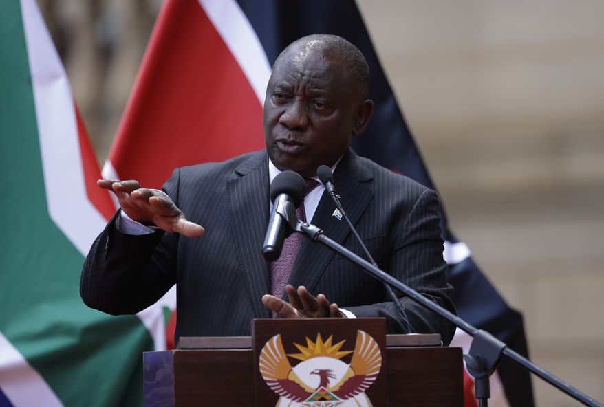 South African President Cyril Ramaphosa addresses the media after meeting with his Kenyan counterpart Uhuru Kenyatta in Pretoria, South Africa, Tuesday Nov. 23, 2021. Travel restrictions imposed on South Africa and other African nations for telling the world about the omicron variant are hypocritical, harsh and not supported by science, South Africa&#39;s president said Monday, recalling the phrase used by the U.N. chief, who called such measures “travel apartheid.” (AP Photo/Themba Hadebe)