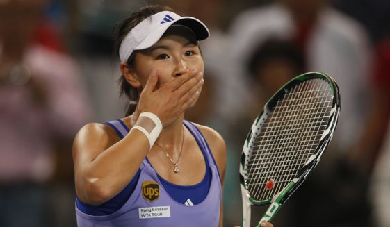 Chinese tennis player Peng Shuai reacts during a tennis match in Beijing, China on Oct. 6, 2009. When Peng disappeared from public view this month after accusing a senior Chinese politician of sexual assault, it caused an international uproar. But back in China, Peng is just one of several people, activists and accusers alike, who have been hustled out of view, charged with crimes or trolled and silenced online for speaking out about the harassment, violence and discrimination women face every day. (AP Photo/Ng Han Guan)