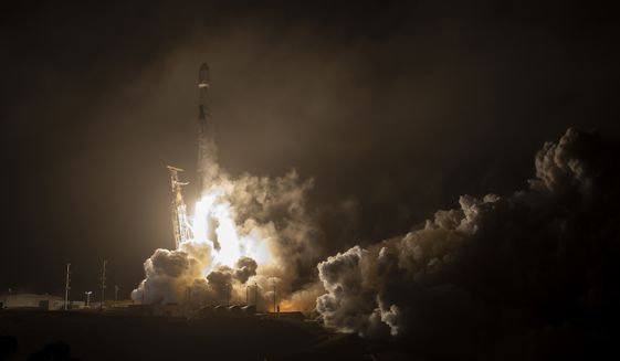 The SpaceX Falcon 9 rocket launches with the Double Asteroid Redirection Test, or DART, spacecraft onboard, Tuesday, Nov. 23, 2021, from Space Launch Complex 4E at Vandenberg Space Force Base in California. NASA launched the spacecraft Tuesday night on the DART mission to smash into an asteroid and test whether it would be possible to knock a speeding space rock off course if one were to threaten Earth. (Bill Ingalls/NASA via AP)