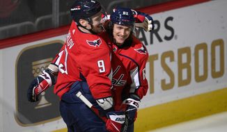 Washington Capitals defenseman Dmitry Orlov (9) celebrates his goal with left wing Carl Hagelin (62) during the third period of the team&#39;s NHL hockey game against the Montreal Canadiens, Wednesday, Nov. 24, 2021, in Washington. (AP Photo/Nick Wass)