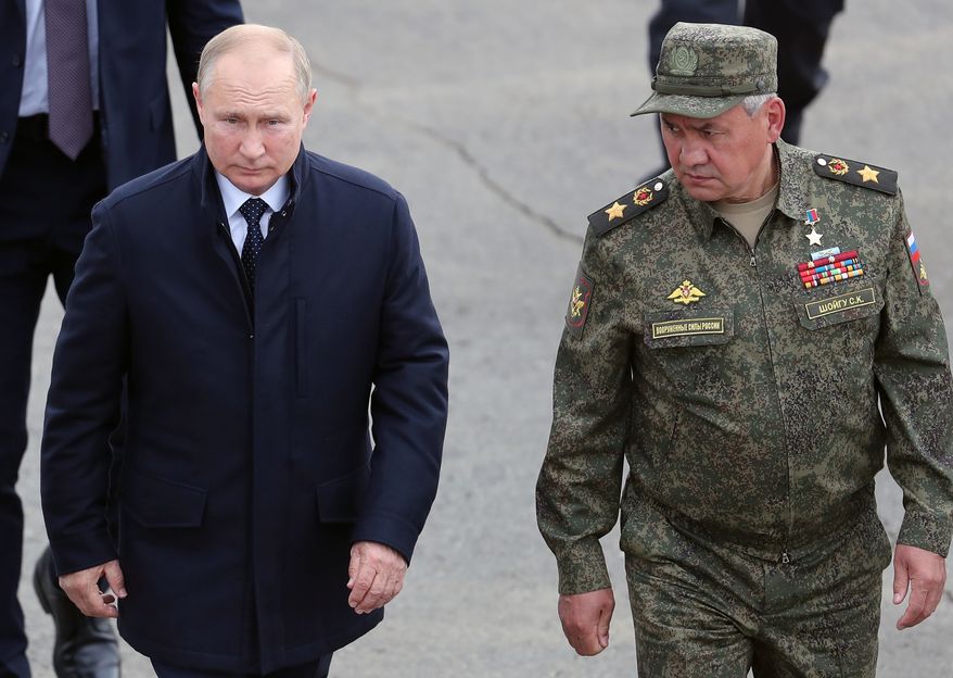 Russian President Vladimir Putin, left, and Russian Defense Minister Sergei Shoigu arrive to attend the joint strategic exercise of the armed forces of the Russian Federation and the Republic of Belarus Zapad-2021 at the Mulino training ground in the Nizhny Novgorod region, Russia, on Sept. 13, 2021. (Sergei Savostyanov, Sputnik, Kremlin Pool Photo via AP, File)