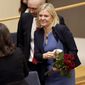 Sweden&#39;s Finance Minister and Social Democratic Party leader Magdalena Andersson holds flowers after a vote appointing her as Sweden&#39;s new prime minister, in the Swedish parliament Riksdagen, in Stockholm, Wednesday, Nov. 24, 2021. Sweden&#39;s parliament has approved Andersson as the country&#39;s first female prime minister. (Erik Simander/TT News Agency via AP)