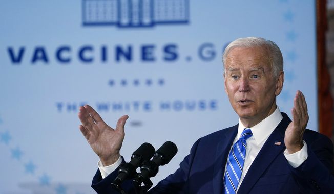 In this file photo, President Joe Biden speaks about COVID-19 vaccinations after touring a Clayco Corporation construction site for a Microsoft data center in Elk Grove Village, Ill., on Oct. 7, 2021.  (AP Photo/Susan Walsh, File)