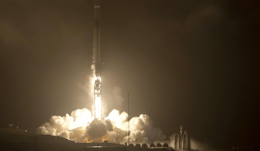 The SpaceX Falcon 9 rocket launches with the Double Asteroid Redirection Test, or DART, spacecraft onboard, Tuesday, Nov. 23, 2021, Pacific time (Nov. 24 Eastern time) from Space Launch Complex 4E, at Vandenberg Space Force Base in Calif. NASA launched the spacecraft on a mission to smash into an asteroid and test whether it would be possible to knock a speeding space rock off course if one were to threaten Earth. (Bill Ingalls/NASA via AP)