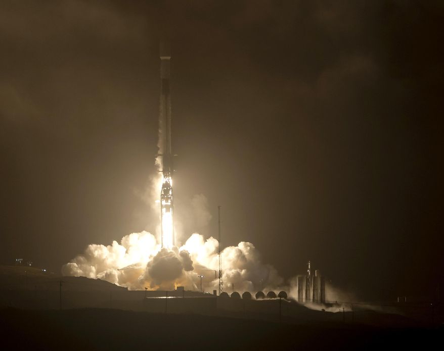 The SpaceX Falcon 9 rocket launches with the Double Asteroid Redirection Test, or DART, spacecraft onboard, Tuesday, Nov. 23, 2021, Pacific time (Nov. 24 Eastern time) from Space Launch Complex 4E, at Vandenberg Space Force Base in Calif. NASA launched the spacecraft on a mission to smash into an asteroid and test whether it would be possible to knock a speeding space rock off course if one were to threaten Earth. (Bill Ingalls/NASA via AP)