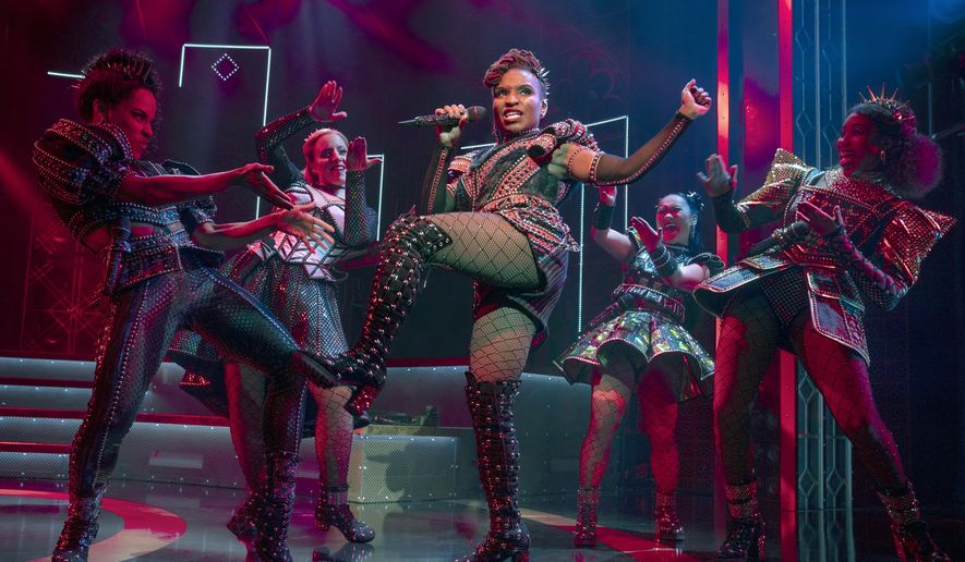 Brittney Mack portrays Anna of Cleves, center, during a performance of the musical &amp;quot;Six,&amp;quot; at Broadway’s Brooks Atkinson Theatre in New York. Mack is slated to perform a mashup of some of its songs with her castmates and band in front of a televised audience of millions at the Macy’s Thanksgiving Day Parade. (Joan Marcus/Boneau/Bryan-Brown via AP)