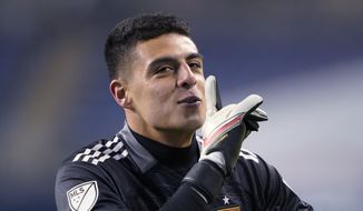 Real Salt Lake goalkeeper David Ochoa motions to fans in a gesture to quiet them after the team&#39;s win over the Seattle Sounders in penalty kicks after a scoreless MLS first-round playoff soccer match Tuesday, Nov. 23, 2021, in Seattle. (AP Photo/Ted S. Warren)