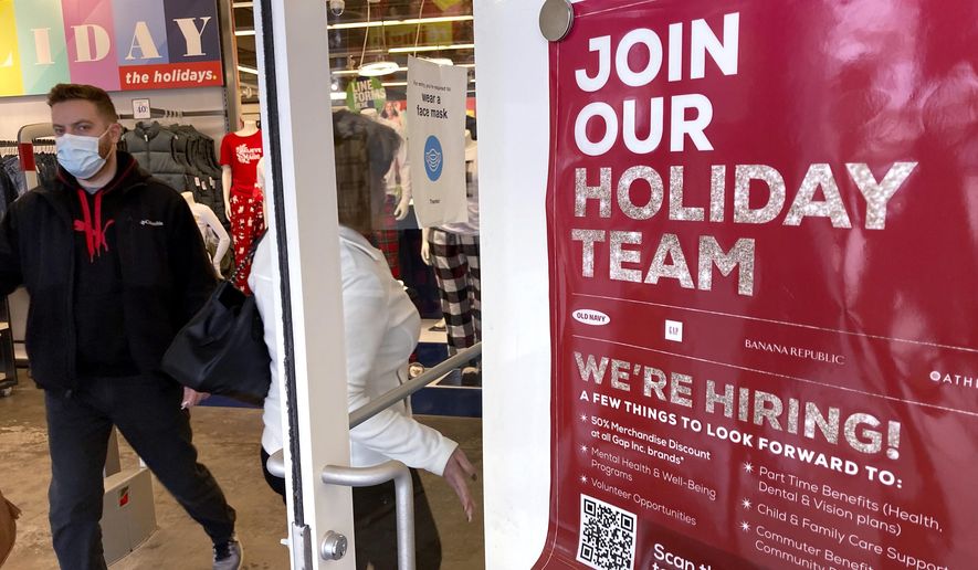 Holiday hiring sign is displayed at a retail store in Vernon Hills, Ill., Saturday, Nov. 13, 2021. (AP Photo/Nam Y. Huh) ** FILE **