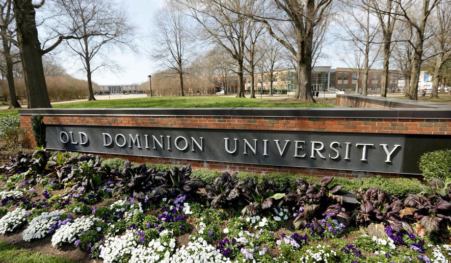 Flowers bloom in front of Old Dominion University on March 12, 2020, in Norfolk, Va. An Old Dominion University professor announced that they will resign in the wake of threats made over their recently published book, which includes interviews of more than 40 adults who are sexually attracted to minors. The book argues that destigmatizing that attraction would allow more people to seek help and develop coping strategies against committing crimes and ultimately prevent child sexual abuse. Professor Allyn Walker said in a statement that their research "was mischaracterized by some in the media and online, partly on the basis of my trans identity." (Stephen M. Katz/The Virginian-Pilot via AP)