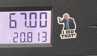 Stickers featuring President Joe Biden pointing at the gas total and saying &quot;I did that!&quot; have been spotted at several gas stations around the country. (Kerry Picket/The Washington Times)