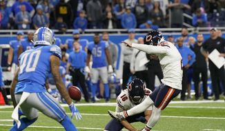 Chicago Bears kicker Cairo Santos kicks the winining field goal with time expiring to defeat the Detroit Lions 16-14 during the second half of an NFL football game, Thursday, Nov. 25, 2021, in Detroit. (AP Photo/Carlos Osorio)