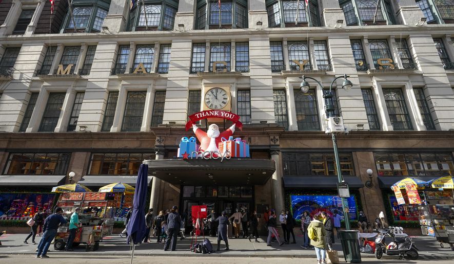 Black Friday shoppers walk past Macy&#39;s flagship store, Friday, Nov. 27, 2020, in New York&#39;s Herald Square. (AP Photo/Mary Altaffer, File)