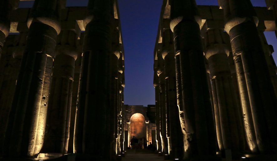 People visit the Luxor Temple in Egypt, Saturday, Sept. 9, 2017.   Egyptian authorities are poised to unveil a renovated ancient promenade that dates back 3,000 years. The ceremony on Thursday, Nov. 25, 2021, is meant to highlight the country’s archaeological treasures as Egypt struggles to revive its tourism industry, battered by years of political turmoil and more lately, the coronavirus pandemic.(AP Photo/Nariman El-Mofty, File)