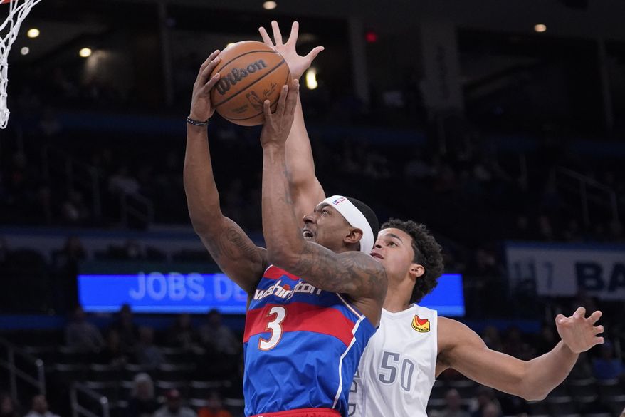 Washington Wizards guard Bradley Beal (3) goes to the basket in front of Oklahoma City Thunder forward Jeremiah Robinson-Earl (50) in the first half of an NBA basketball game Friday, Nov. 26, 2021, in Oklahoma City. (AP Photo/Sue Ogrocki)