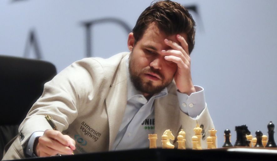 Carlsen earns Game 1 draw with Nepomniachtchi at World Chess