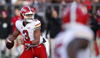 Maryland quarterback Taulia Tagovailoa (3) looks to pass against Rutgers during the second half of an NCAA football game, Saturday, Nov. 27, 2021, in Piscataway, N.J. Maryland won 40-16. (AP Photo/Noah K. Murray)