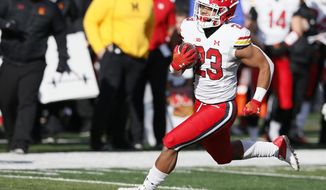 Maryland running back Colby McDonald (23) rushes against Rutgers during the first half of an NCAA football game, Saturday, Nov. 27, 2021, in Piscataway, N.J. (AP Photo/Noah K. Murray)