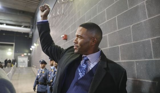 Former New York Giants player Michael Strahan gestures in the tunnel before a halftime ceremony at an NFL football game between the New York Giants and the Philadelphia Eagles, Sunday, Nov. 28, 2021, in East Rutherford, N.J. (AP Photo/John Munson)