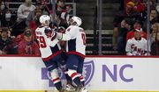 Washington Capitals' Aliaksei Protas (59) celebrates his goal with teammate Alex Ovechkin (8) during the second period of an NHL hockey game against the Carolina Hurricanes in Raleigh, N.C., Sunday, Nov. 28, 2021. (AP Photo/Karl B DeBlaker)