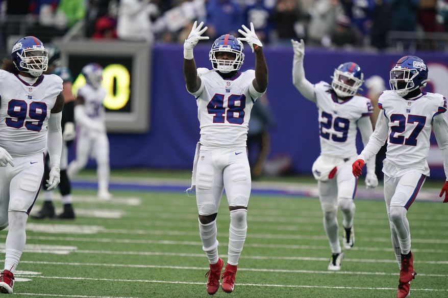 New York Giants&#39; Tae Crowder (48) celebrates his interception during the first half of an NFL football game against the Philadelphia Eagles, Sunday, Nov. 28, 2021, in East Rutherford, N.J. (AP Photo/Corey Sipkin)