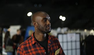 Designer Virgil Abloh walks backstage prior to his Off-White ready-to-wear Fall-Winter 2019-2020 collection, that was presented in Paris, Thursday, Feb. 28, 2019. Abloh, a leading fashion executive hailed as the Karl Lagerfeld of his generation, has died after a private battle with cancer. He was 41. Abloh’s death was announced Sunday, Nov. 28, 2021, by LVMH Louis Vuitton and the Off White label, the brand he founded. (AP Photo/Thibault Camus, File )