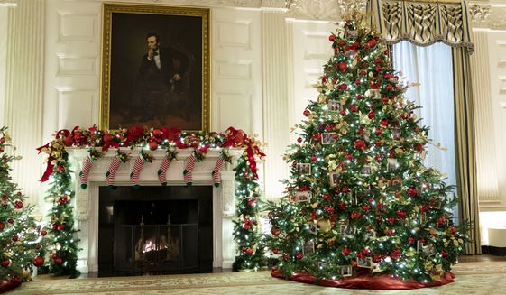 The East Room of the White House is decorated for the holiday season during a press preview of the White House holiday decorations, Monday, Nov. 29, 2021, in Washington. (AP Photo/Evan Vucci)