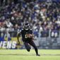 Baltimore Ravens quarterback Lamar Jackson scrambles against the Cleveland Browns during the first half of an NFL football game, Sunday, Nov. 28, 2021, in Baltimore. (AP Photo/Gail Burton) **FILE**