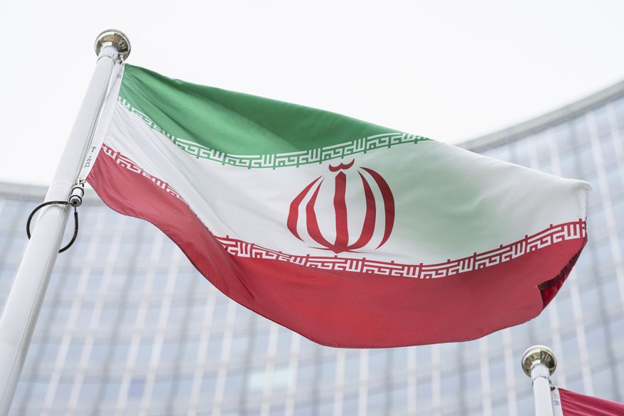 The flag of Iran waves in front of the the International Center building with the headquarters of the International Atomic Energy Agency, IAEA, in Vienna, Austria, May 24, 2021. On Monday, Nov. 29, 2021, negotiators were gathering in Vienna to resume efforts to revive Iran&#39;s 2015 nuclear deal with world powers, with hopes of quick progress muted after the arrival of a hard-line new government in Tehran led to a more than five-month hiatus. (AP Photo/Florian Schroetter, File)
