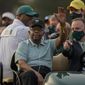 Lee Elder waves as he arrives for the ceremonial tee shots before the first round of the Masters golf tournament on Thursday, April 8, 2021, in Augusta, Ga. At far right is Phil Mickelson. Person at right in cart is unidentified. Elder broke down racial barriers as the first Black golfer to play in the Masters and paved the way for Tiger Woods and others to follow. The PGA Tour confirmed Elder’s death, which was first reported by Debert Cook of African American Golfers Digest. No cause or details were immediately available, but the tour said it spoke with Elder&#39;s family. He was 87. (AP Photo/Charlie Riedel, File) **FILE**