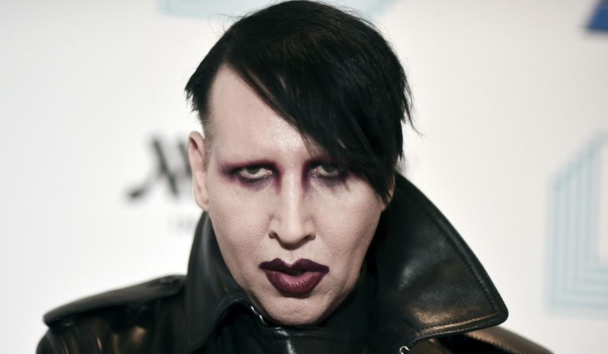 Marilyn Manson attends the 9th annual &amp;quot;Home for the Holidays&amp;quot; benefit concert in Los Angeles, on Dec. 10, 2019. Authorities searched the home of the rocker on Monday, Nov. 29, 2021, after allegations of physical and sexual abuse by several women. (Photo by Richard Shotwell/Invision/AP, File)