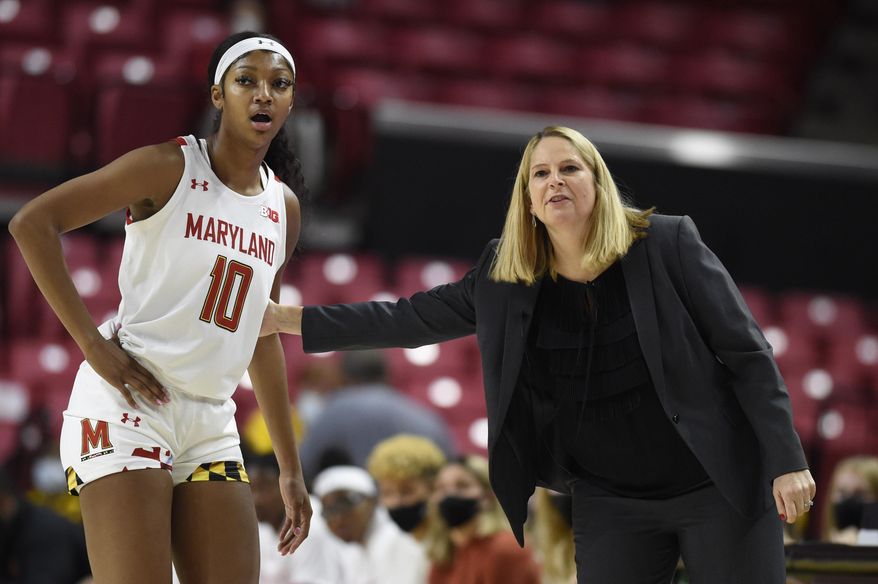Maryland head coach Brenda Frese talks with Angel Reese during the first half of an NCAA college basketball game on Thursday, Nov. 18, 2021, in College Park, Md. Maryland won 108-66. (AP Photo/Gail Burton) **FILE**